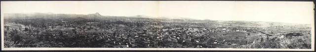 Wide historic panorama of Prescott with downtown buildings, surrounding hills and Thumb Butte, dated 1908 by the Library of Congress